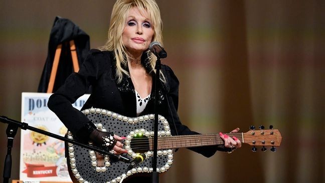 FILE - Dolly Parton appears at an event to celebrate the expansion of the Imagination Library of Kentucky at the Lyric Theatre in Lexington, Ky., on Aug. 27, 2024. (AP Photo/Timothy D. Easley, File)