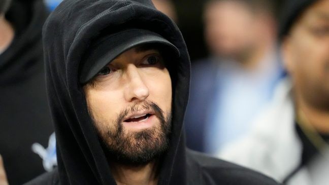 FILE - Eminem is seen during pregame of an NFL wild-card playoff football game, Jan. 14, 2024, in Detroit. (AP Photo/Paul Sancya, file)