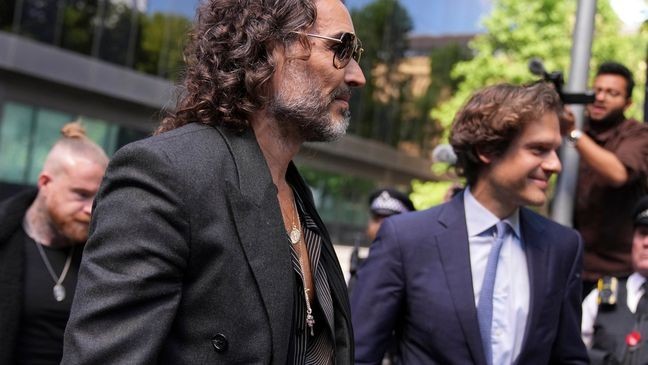 English comedian and actor Russell Brand arrives at Southwark Crown Court where he is charged with rape and sexual assault in London, Friday, May 30, 2025.(AP Photo/Alastair Grant)