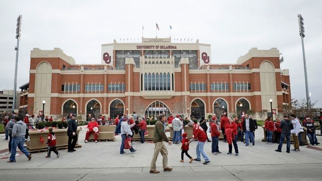 The fans at Gaylord Family Oklahoma Memorial Stadium love their football! During your time in Norman, fans will want to visit the Switzer Center where the football program’s storied history is on full display. After seeing all of the success packed within those walls, your spirit will be ready to sing the famous fight song and cheer on the home team.{&nbsp;}{br}{br}NORMAN, OK - NOVEMBER 11: Oklahoma Sooners fans gather on the south end of the stadium before the game against the TCU Horned Frogs at Gaylord Family Oklahoma Memorial Stadium on November 11, 2017 in Norman, Oklahoma. (Photo by Brett Deering/Getty Images)