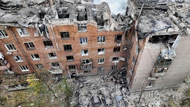 In this image provided by the Ukrainian Emergency Service on Monday, Nov. 11, 2024, a smoke rises out of an apartments building after a Russian attack in Kryvyi Rih, Ukraine. (Ukrainian Emergency Service via AP)