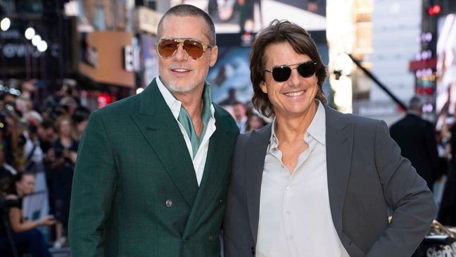 Brad Pitt, left, and Tom Cruise pose for photographers upon arrival at the premiere of the film 'F1 The Movie' on Monday, June 23, 2025, in London. (Photo by Scott A Garfitt/Invision/AP)