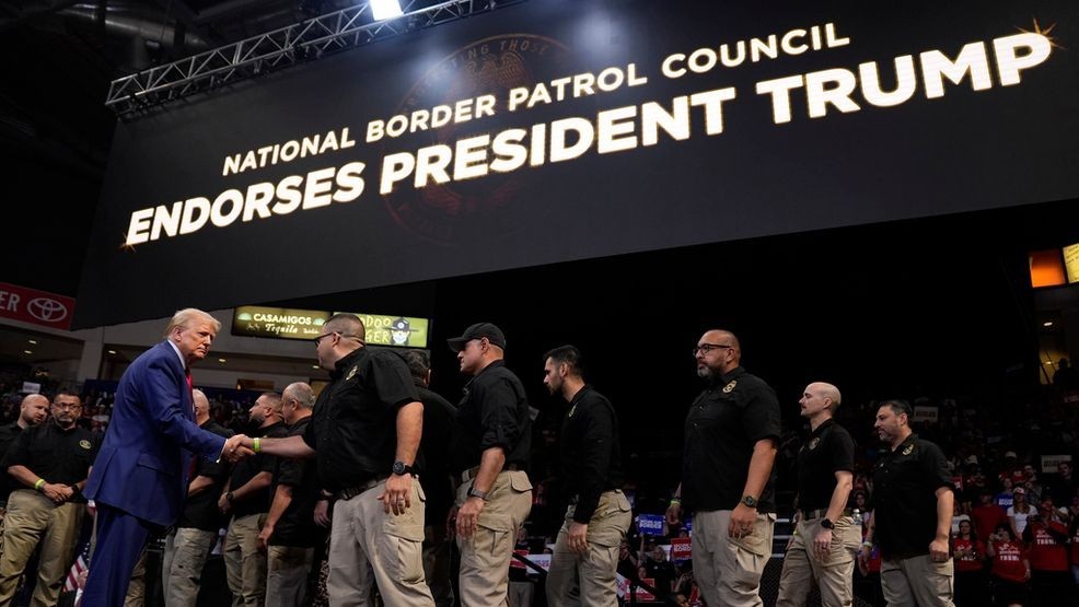 Republican presidential nominee former President Donald Trump greets members of the U.S. Border Patrol as he speaks at a campaign rally at the Findlay Toyota Arena Sunday, Oct. 13, 2024, in Prescott Valley, Ariz. (AP Photo/Evan Vucci)