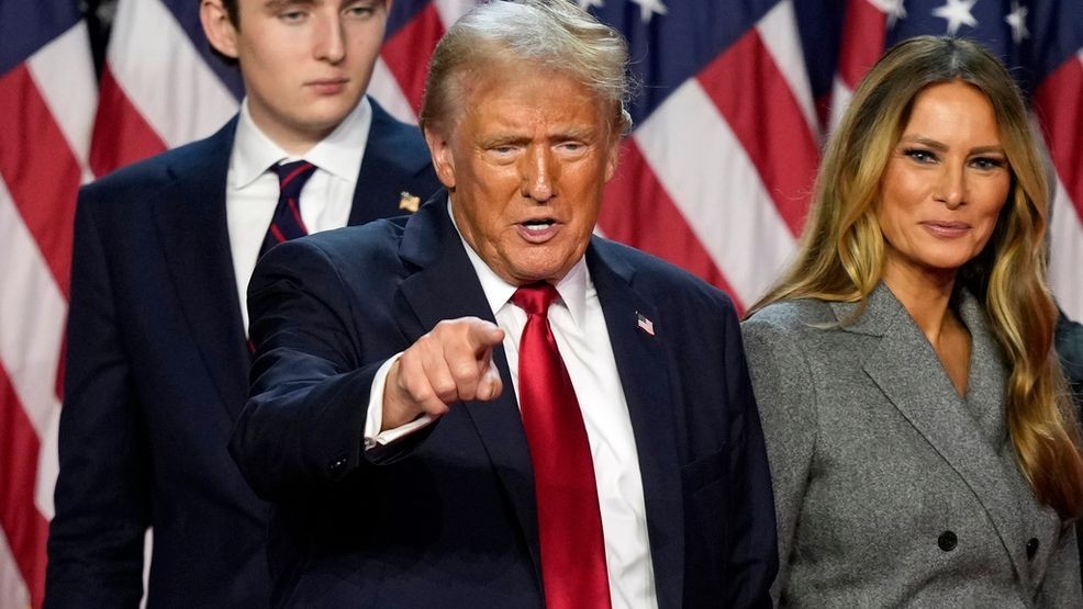 Republican presidential nominee former President Donald Trump departs as son Barron Trump, left, and former first lady Melania Trump look on at an election night watch party, Wednesday, Nov. 6, 2024, in West Palm Beach, Fla. (AP Photo/Alex Brandon)