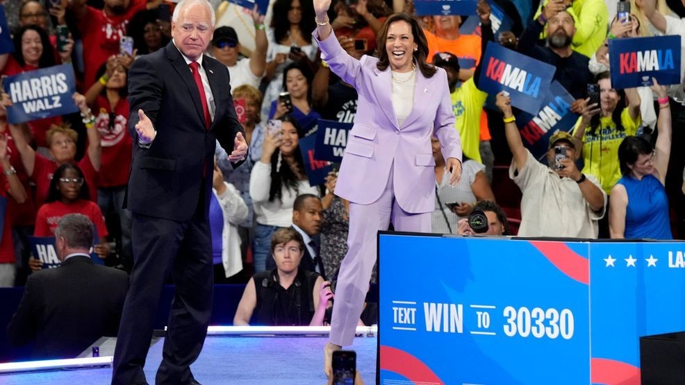 Democratic presidential nominee Vice President Kamala Harris, right, and running mate Minnesota Gov. Tim Walz are pictured at a campaign rally at the University of Nevada, Las Vegas on Saturday, Aug. 10, 2024. (AP Photo/Jae Hong)