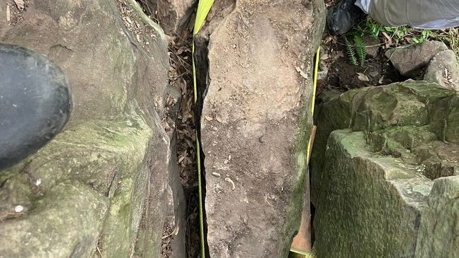 A woman slipped into a 10-foot-deep crevice and spent about seven hours stuck between massive rocks before she was rescued in Australia. (New South Wales Ambulance)