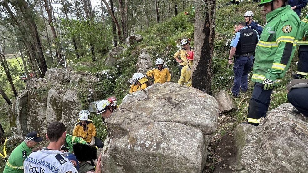 A woman slipped into a 10-foot-deep crevice and spent about seven hours stuck between massive rocks before she was rescued in Australia. (New South Wales Ambulance)