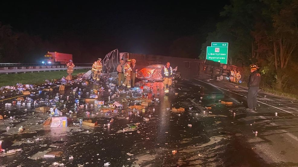 A tractor-trailer rollover crash early Tuesday morning, Oct. 22, 2024, spilled beer cans across Interstate 70 in Frederick County, shutting down all lanes. (Frederick County (MD) Fire & Rescue)