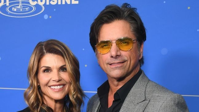 LOS ANGELES, CALIFORNIA - OCTOBER 29: Lori Loughlin and John Stamos attend Cool Comedy Hot Cuisine Benefitting The Scleroderma Research Foundation at Fairmont Century Plaza on October 29, 2024 in Los Angeles, California. (Photo by Alberto E. Rodriguez/Getty Images)