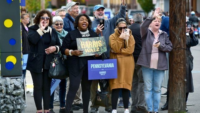 Supporters cheer for former President Bill Clinton while he campaigns for Democratic Party presidential nominee Vice President Kamala Harris during a stop at Bottle Works in the Cambria City section of Johnstown, Pa., Tuesday, Oct. 29, 2024.  (Thomas Slusser/The Tribune-Democrat via AP)