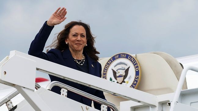 Vice President Kamala Harris waves as she departs Andrews Air Force, Md., Wednesday, July 31, 2024, enroute to Houston. (Kevin Lamarque/Pool via AP)