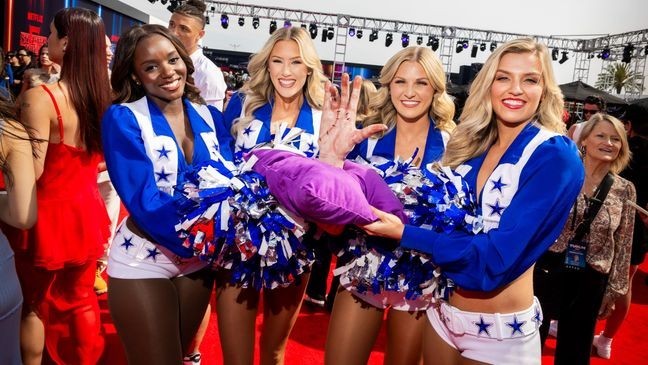 INGLEWOOD, CALIFORNIA - MAY 31: (L-R) Kelee Norris, Megan McElaney, Kennedy Hannan, and Madeline Salter of The Dallas Cowboy Cheerleaders pose with Thing during NETFLIX TUDUM 2025: THE LIVE EVENT at The Kia Forum on May 31, 2025 in Inglewood, California. (Photo by Roger Kisby/Getty Images for Netflix)