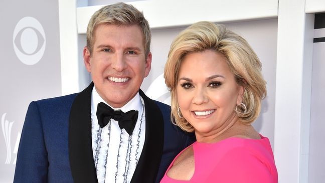 TV personalities Todd Chrisley (L) and Julie Chrisley attend the 52nd Academy Of Country Music Awards at Toshiba Plaza on April 2, 2017 in Las Vegas, Nevada.  (Photo by Kevin Mazur/ACMA2017/Getty Images for ACM)
