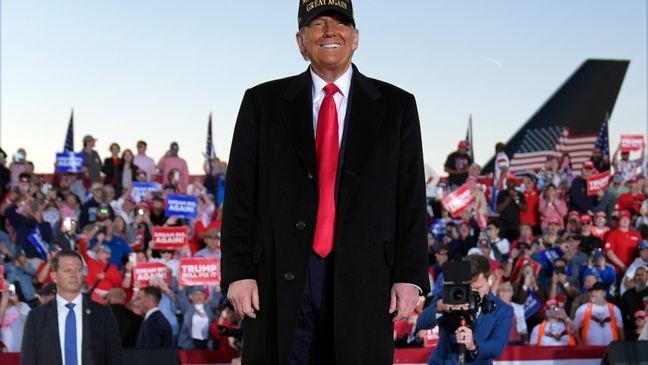 Republican presidential nominee former President Donald Trump smiles at a campaign rally at Kinston Regional Jetport, Sunday, Nov. 3, 2024, in Kinston, N.C. (AP Photo/Evan Vucci)