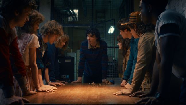 STRANGER THINGS: SEASON 5. (L to R) Joe Keery as Steve Harrington, Natalia Dyer as Nancy Wheeler, Charlie Heaton as Jonathan Byers, Maya Hawke as Robin Buckley, Finn Wolfhard as Mike Wheeler, Winona Ryder as Joyce Byers, Noah Schnapp as Will Byers, Gaten Matarazzo as Dustin Henderson, and Caleb McLaughlin as Lucas Sinclair in Stranger Things: Season 5. Cr. COURTESY OF NETFLIX © 2025