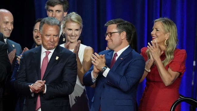 House Speaker Mike Johnson, R-La., and his wife Kelly, right, react as they listen to Republican Presidential nominee former President Donald Trump speaking at the Palm Beach County Convention Center during an election night watch party, Wednesday, Nov. 6, 2024, in West Palm Beach, Fla. (AP Photo/Lynne Sladky)