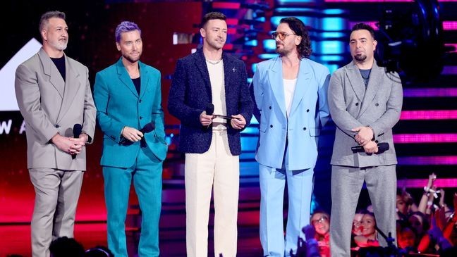 NEWARK, NEW JERSEY - SEPTEMBER 12: (L-R) Joey Fatone, Lance Bass, Justin Timberlake, JC Chasez, and Chris Kirkpatrick of  *NSYNC speak onstage the 2023 MTV Video Music Awards at Prudential Center on September 12, 2023 in Newark, New Jersey. (Photo by Theo Wargo/Getty Images for MTV)