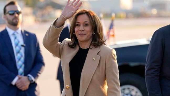 Democratic presidential nominee Vice President Kamala Harris waves as she arrives at Raleigh-Durham International Airport in Morrisville, N.C., Saturday, Oct. 12, 2024. (AP Photo/Steve Helber)