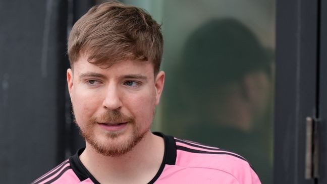 FILE - Jimmy Donaldson, the YouTube star known as MrBeast, stands in a sideline box at an MLS soccer match on March 10, 2024, in Fort Lauderdale, Fla. (AP Photo/Rebecca Blackwell, File)