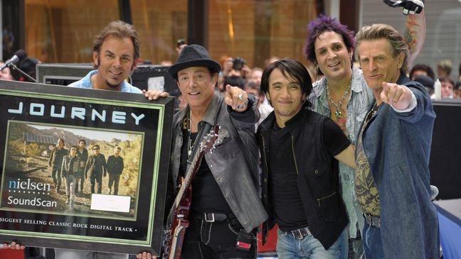 NEW YORK, NY - JULY 29: (L-R) keyboard player Jonathan Cain, guitar player Neal Schon, singer Arnel Pineda, drummer Deen Castronovo, and bass player Ross Valory of the band Journey performs\ at the 2011 Today Summer Concert series at Rockefeller Plaza on July 29, 2011 in New York City. (Photo by Mike Coppola/Getty Images)
