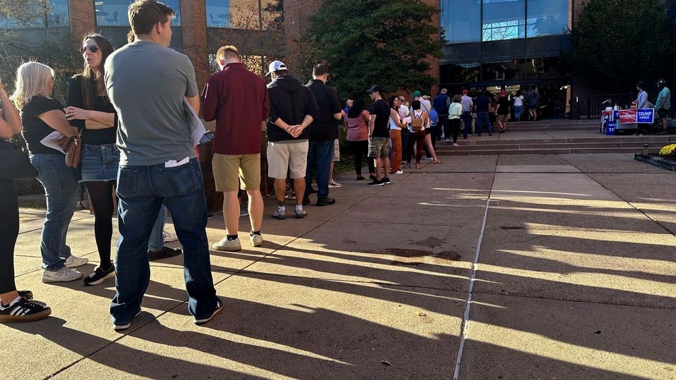 Voters line up outside the Bucks County Administration Building during early voting in the general election, Friday, Nov. 1, 2024, in Doylestown, Pa. (AP Photo/Michael Rubinkam)