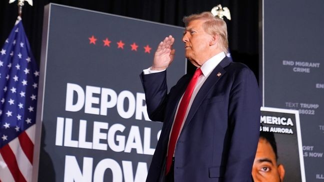 Republican presidential nominee former President Donald Trump salutes at a campaign rally at the Gaylord Rockies Resort & Convention Center, Friday, Oct. 11, 2024, in Aurora, Colo. (AP Photo/Alex Brandon)