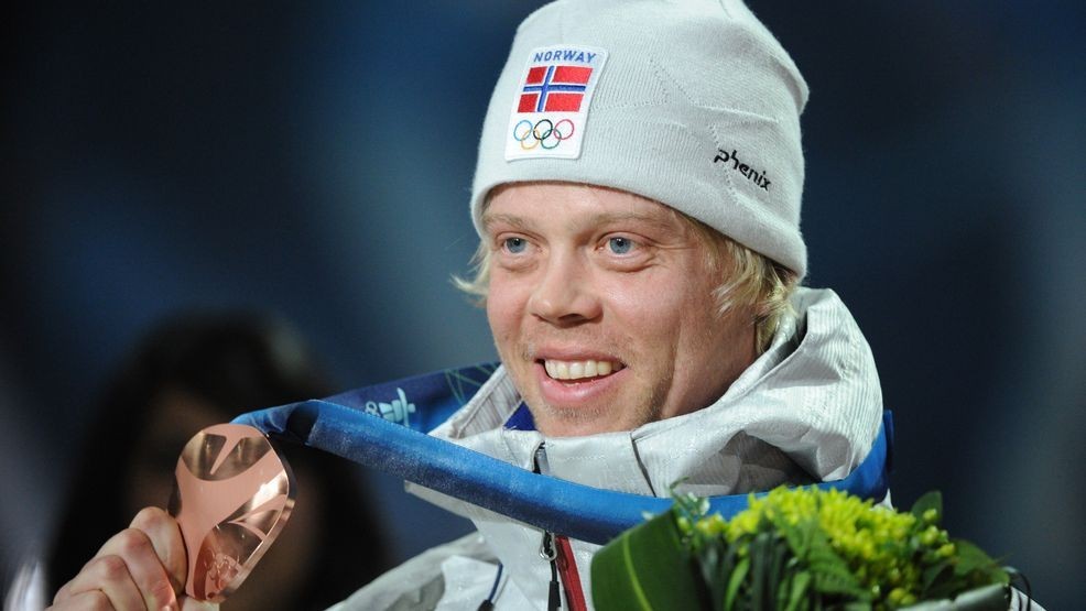 Norway's bronze winner Audun Groenvold celebrates on the podium during the medal ceremony of the men's freestyle ski cross final of the Vancouver Winter Olympics, on February 21, 2010.    AFP PHOTO / MARTIN BUREAU (Photo credit should read MARTIN BUREAU/AFP via Getty Images)