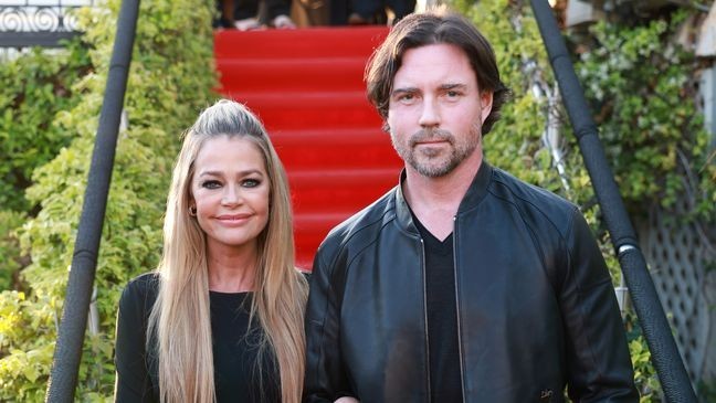 CANNES, FRANCE - APRIL 18: Denise Richards and Aaron Phypers attend the "Paper Empire" Tv Show Event at Annex Beach on April 18, 2023 in Cannes, France. (Photo by Arnold Jerocki/Getty Images for Robert Gillings Productions / JOPR)