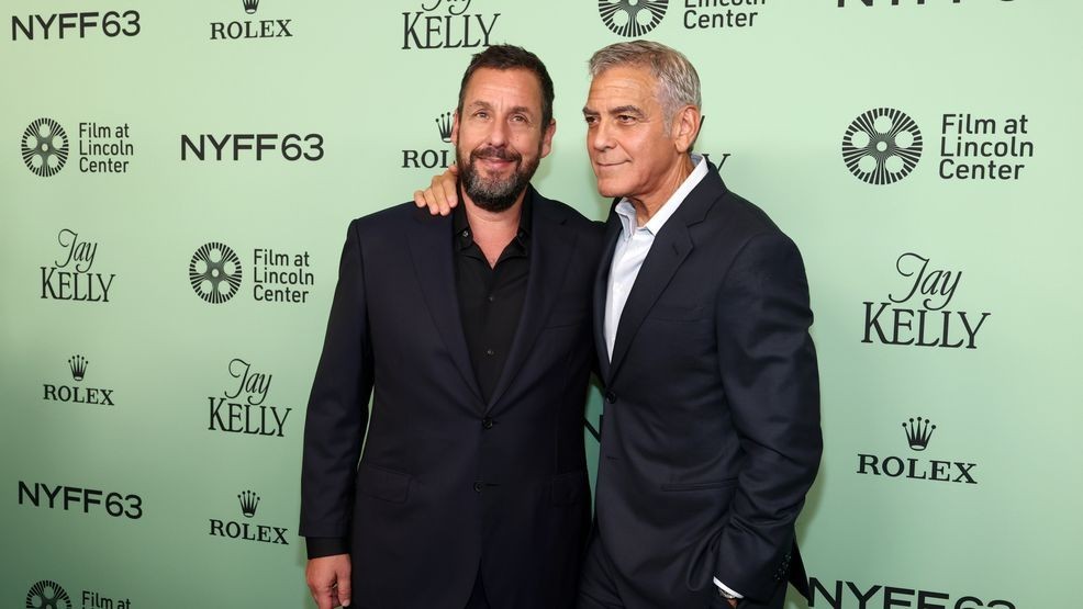 Image for story: George Clooney gave Adam Sandler a makeover on the red carpet