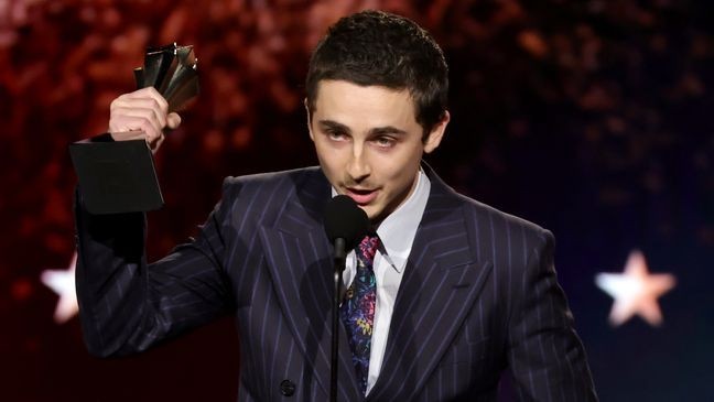 SANTA MONICA, CALIFORNIA - JANUARY 04: Timothée Chalamet, winner of the Best Actor Award for "Marty Supreme", speaks onstage during the 31st Annual Critics Choice Awards at Barker Hangar on January 04, 2026 in Santa Monica, California.  (Photo by Kevin Winter/Getty Images for Critics Choice Association)