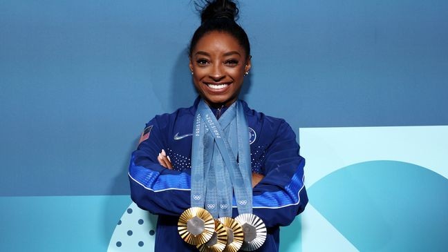 PARIS, FRANCE - AUGUST 05: Simone Biles of Team United States poses with her Paris 2024 Olympic medals following the Artistic Gymnastics Women's Floor Exercise Final on day ten of the Olympic Games Paris 2024 at Bercy Arena on August 05, 2024 in Paris, France. (Photo by Jamie Squire/Getty Images)