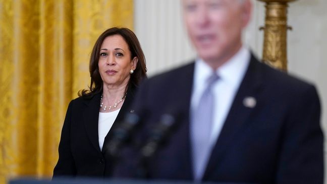 FILE - Vice President Kamala Harris listens as President Joe Biden speaks about distribution of COVID-19 vaccines, in the East Room of the White House, May 17, 2021, in Washington. (AP Photo/Evan Vucci, File)