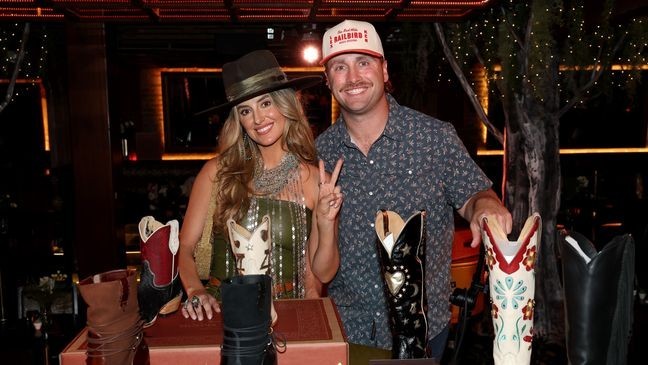 NASHVILLE, TENNESSEE - JUNE 04: (L-R) Lainey Wilson and Devlin Hodges attend the launch of Golden West Boots at Lainey Wilson’s Bell Bottoms Up on June 04, 2025 in Nashville, Tennessee. (Photo by Terry Wyatt/Getty Images for Golden West Boots)