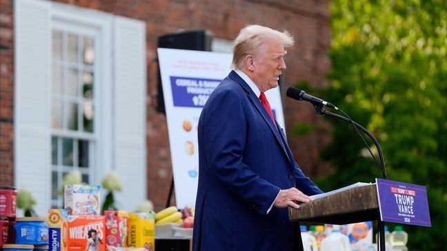 With consumer goods placed on tables near him, Republican presidential nominee former President Donald Trump speaks at a news conference at Trump National Golf Club, Thursday, Aug. 15, 2024, in Bedminster, N.J. (AP Photo/Julia Nikhinson)