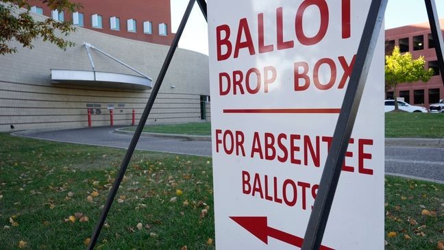 A drop slot for voting ballots and absentee applications is shown outside of the Warren City Hall complex Thursday, Oct. 24, 2024, in Warren, Mich. (AP Photo/Paul Sancya)