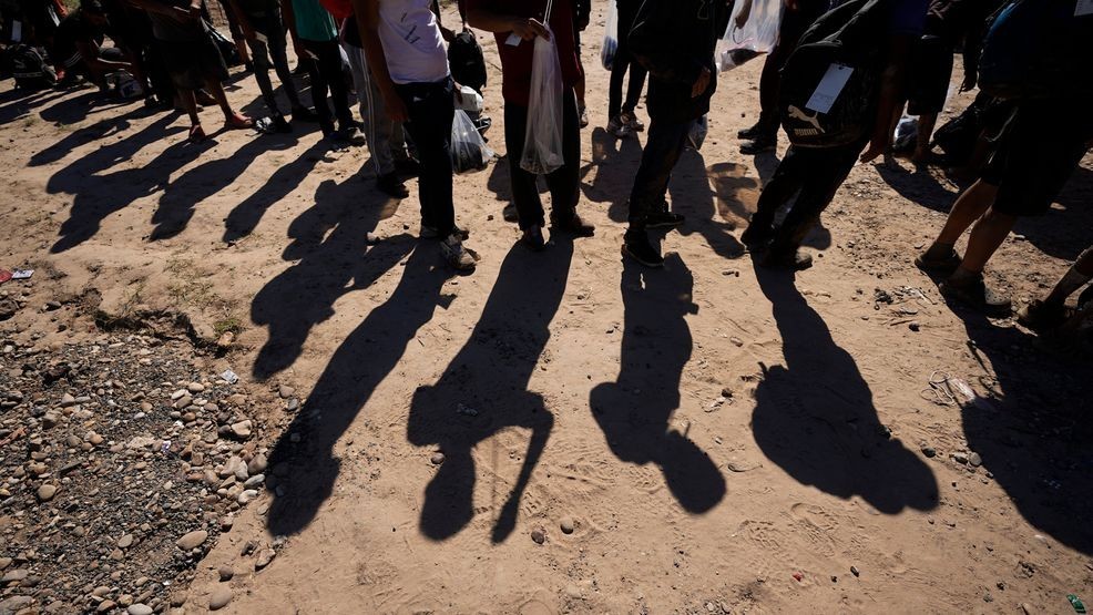 FILE - Migrants wait to be processed by the U.S. Customs and Border Patrol after they crossed the Rio Grande and entered the U.S. from Mexico, on Oct. 19, 2023, in Eagle Pass, Texas. (AP Photo/Eric Gay, File)