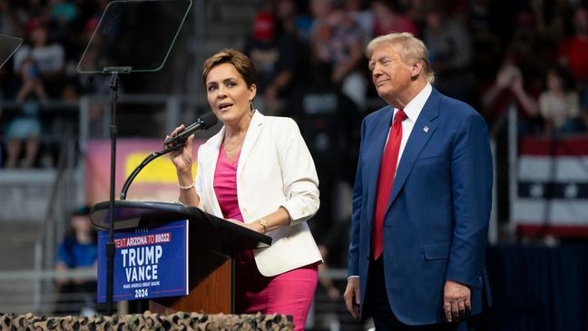 FILE - U.S. Republican presidential nominee, former President Donald Trump invites Arizona Republican U.S. Senate candidate Kari Lake on stage during a campaign rally at Findlay Toyota Center on October 13, 2024 in Prescott Valley, Arizona. (Photo by Rebecca Noble/Getty Images)