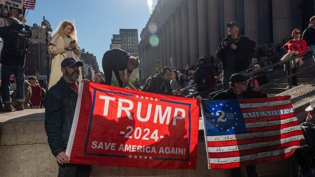 NEW YORK, NEW YORK - OCTOBER 27: Protestors and supporters of Republican presidential nominee, former President Donald Trump, gather outside of Madison Square Garden on October 27, 2024 in New York City. Trump closed out his weekend of campaigning at Madison Square Garden in New York City with a guest list of speakers that includes his running mate Republican Vice Presidential nominee, U.S. Sen. J.D. Vance (R-OH), Tesla CEO Elon Musk, UFC CEO Dana White, and House Speaker Mike Johnson, among others, nine days before Election Day. (Photo by Spencer Platt/Getty Images)