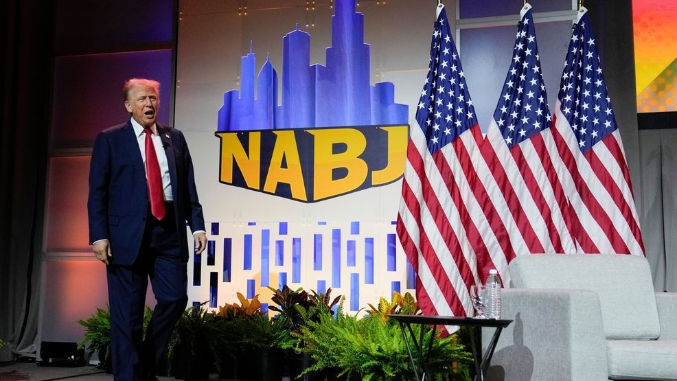 Republican presidential candidate former President Donald Trump walks on stage at the National Association of Black Journalists, NABJ, convention, Wednesday, July 31, 2024, in Chicago. (AP Photo/Charles Rex Arbogast)