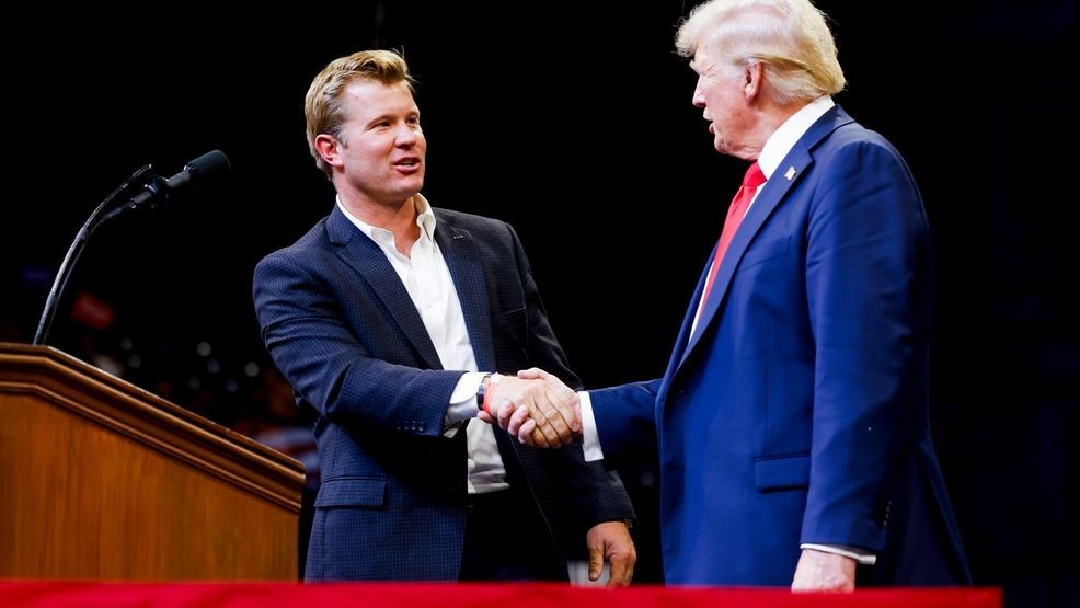 FILE - Montana Republican U.S. Senate candidate Tim Sheehy shakes hands with former President Donald Trump at a rally on August 9, 2024, in Bozeman, Montana. (Photo by Michael Ciaglo/Getty Images)