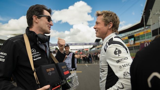 Director Joseph Kosinski and Brad Pitt on the set of "F1." (Photo by Scott Garfield. Courtesy Warner Bros Pictures / Apple Original Films)
