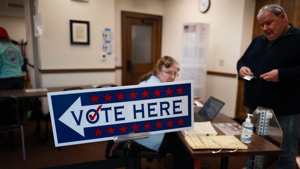 Residents vote at an in-person early voting location at city hall on October 24, 2024 in Racine, Wisconsin. Early voting numbers have been high across the state since the process began on Tuesday. (Photo by Scott Olson/Getty Images)