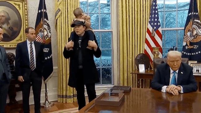 X on Elon Musk's shoulders in the Oval Office at the White House, Tuesday, Feb. 11, 2025, in Washington. (Pool)