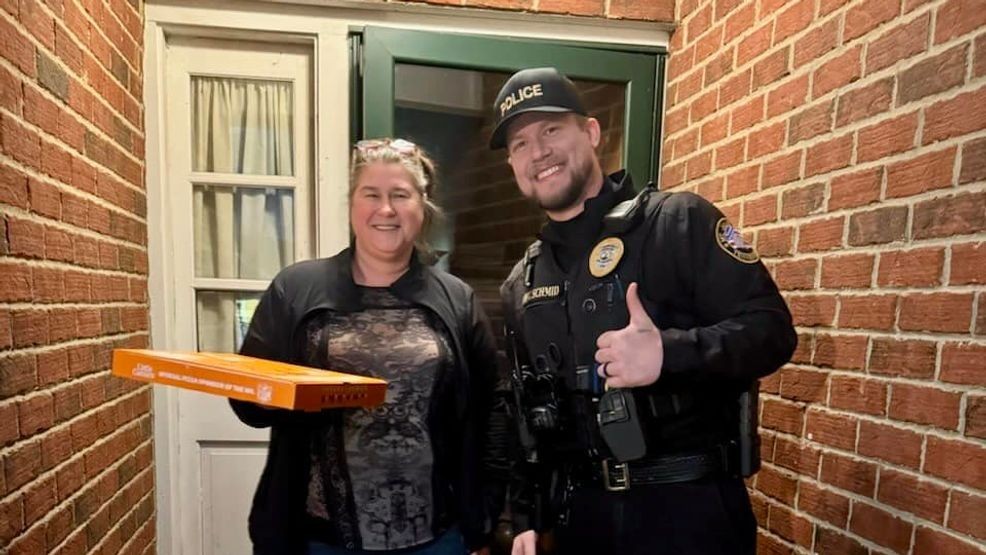 Image for story: Police officers complete pizza delivery after arresting driver