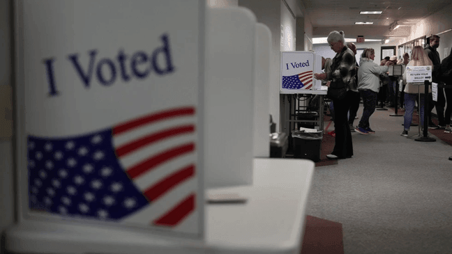 People fill out mail-in ballots for the 2024 General Election in the United States at a Voters Services satellite office at the Chester County Government Services Center, Friday, Oct. 25, 2024, in West Chester, Pa. (AP Photo/Matt Slocum)