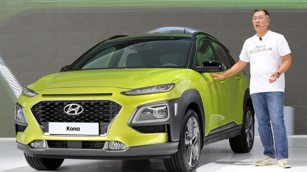 Euisun Chung, a vice chairman of Hyundai Motor, speaks next to new SUV Kona during its world premiere in Goyang, South Korea, Tuesday, June 13, 2017. Hyundai Motor Co. is playing catch up in the fast-growing sport utility vehicle market with its first subcompact SUV targeting Europe and North America. (AP Photo/Lee Jin-man)