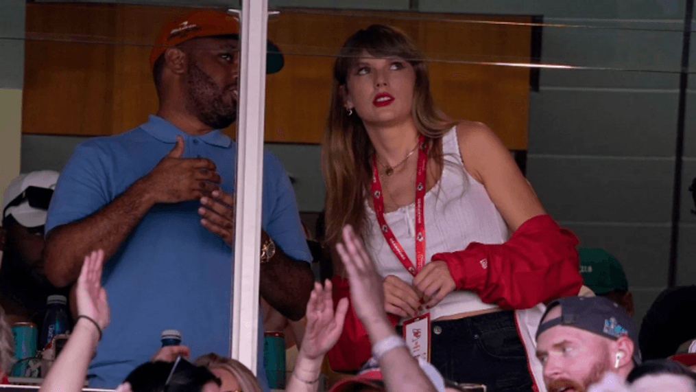 Taylor Swift watches from a suite inside Arrowhead Stadium during the first half of an NFL football game between the Chicago Bears and Kansas City Chiefs Sunday, Sept. 24, 2023, in Kansas City, Mo. (AP Photo/Ed Zurga)