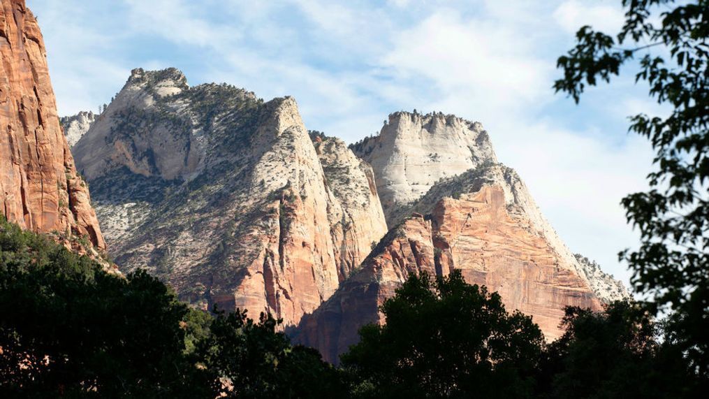 The morning sun lights up large rock formations in Zion National Park in Utah. (Photo by George Frey/Getty Images) 