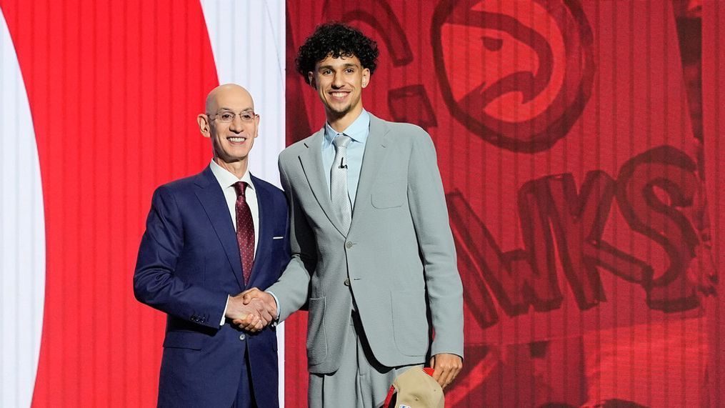 Zaccharie Risacher, right, poses for a photo with NBA commissioner Adam Silver after being selected as the first overall pick by the Atlanta Hawks in the first round of the NBA basketball draft, Wednesday, June 26, 2024, in New York. (AP Photo/Julia Nikhinson)