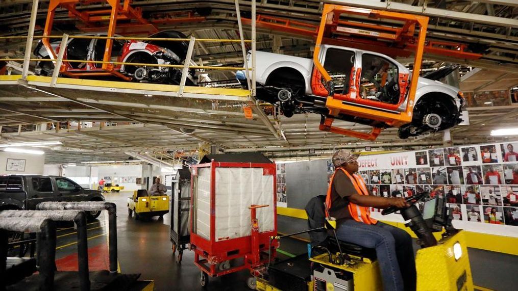 In 2016 photograph, vehicles are suspended above other installation stations as they are moved along the assembly line at the Nissan Canton Vehicle Assembly Plant in Canton, Miss. A bid by workers at Mississippi's Nissan Motor Co. plant for United Auto Workers representation could turn on a key voting bloc: the 1,500 Nissan employees who were initially hired through contract labor agencies. (AP Photo/Rogelio V. Solis, File)